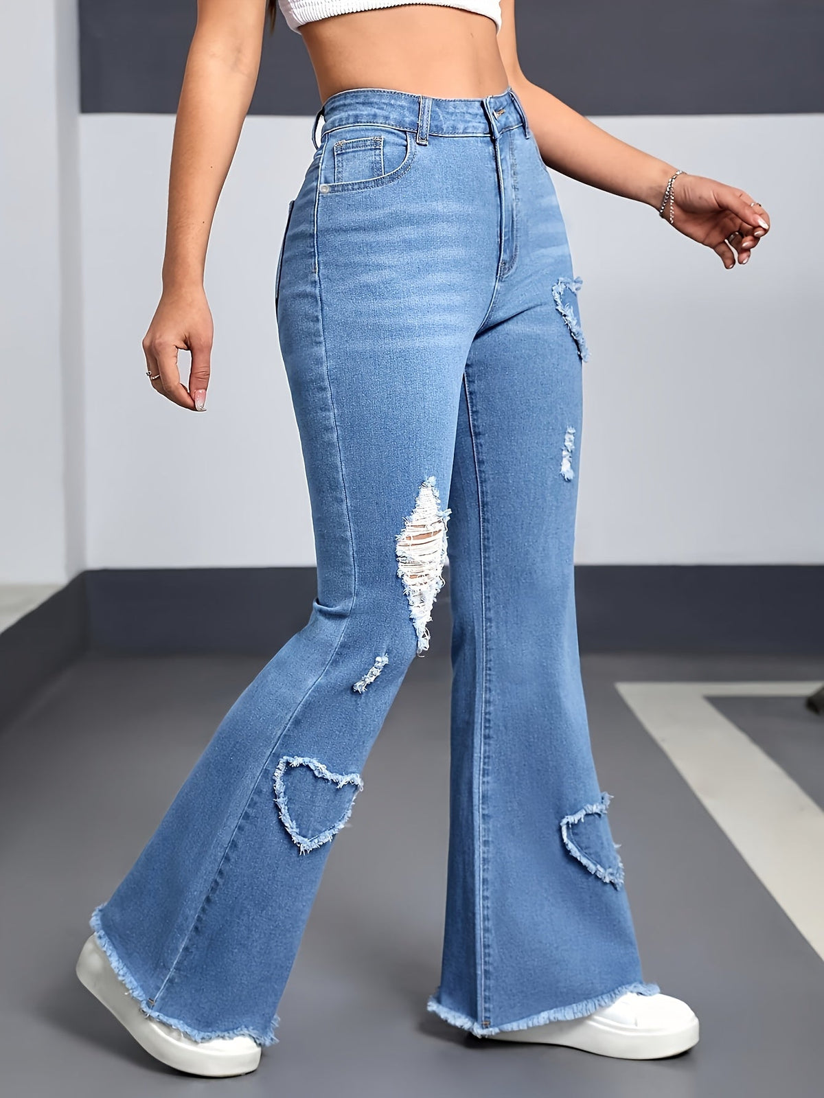 Effortless Light Blue Distressed Flare Jeans for Women with High Waist Heart Patch Frayed Hem Casual Style